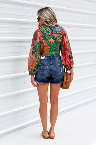 Run Wild Curved Hem Mid Rise Medium Wash Shorts