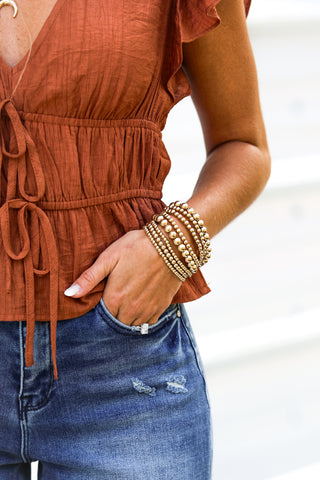 The Brielle Ruffle Rust Top